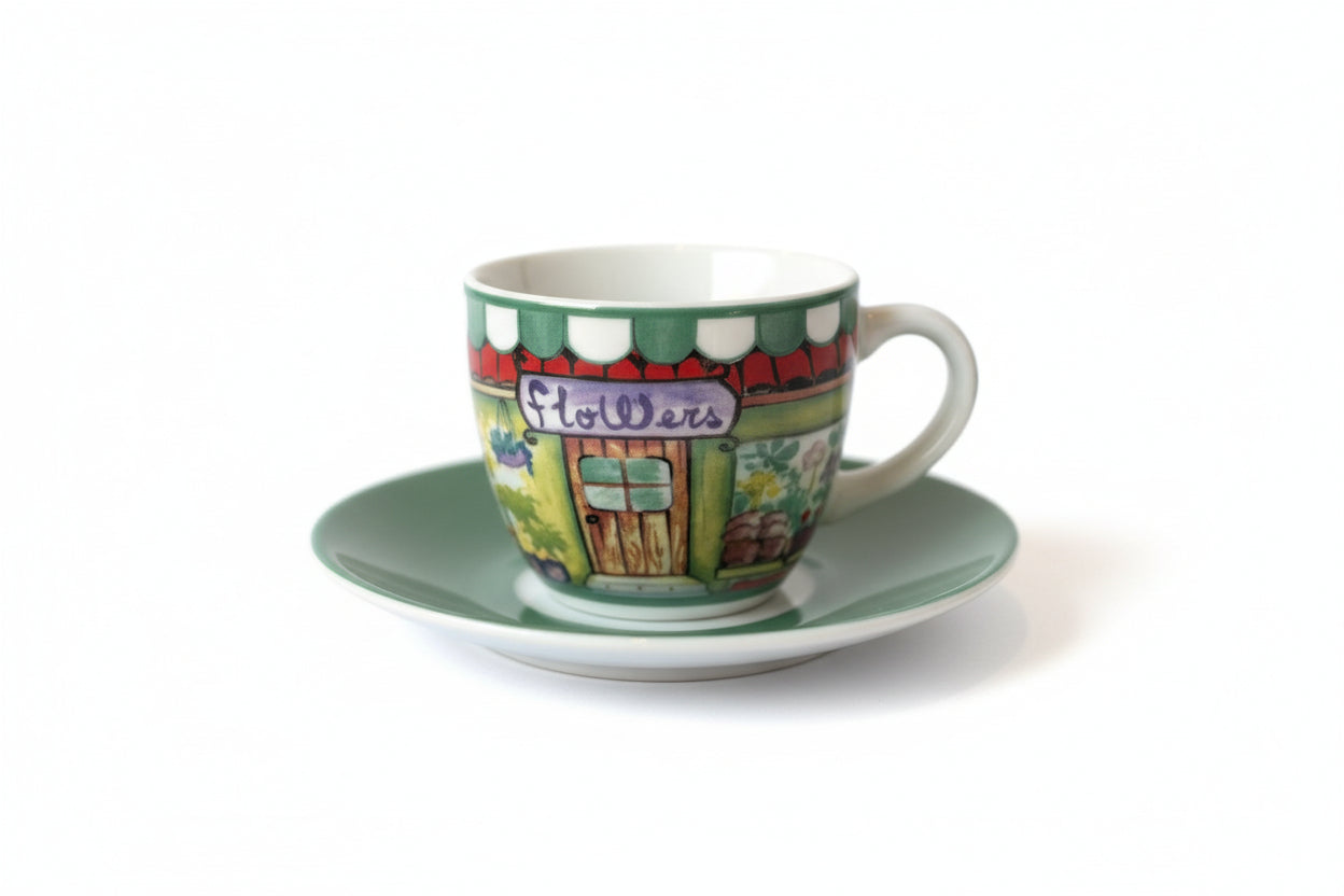 Colorful ceramic cup and saucer on a white surface